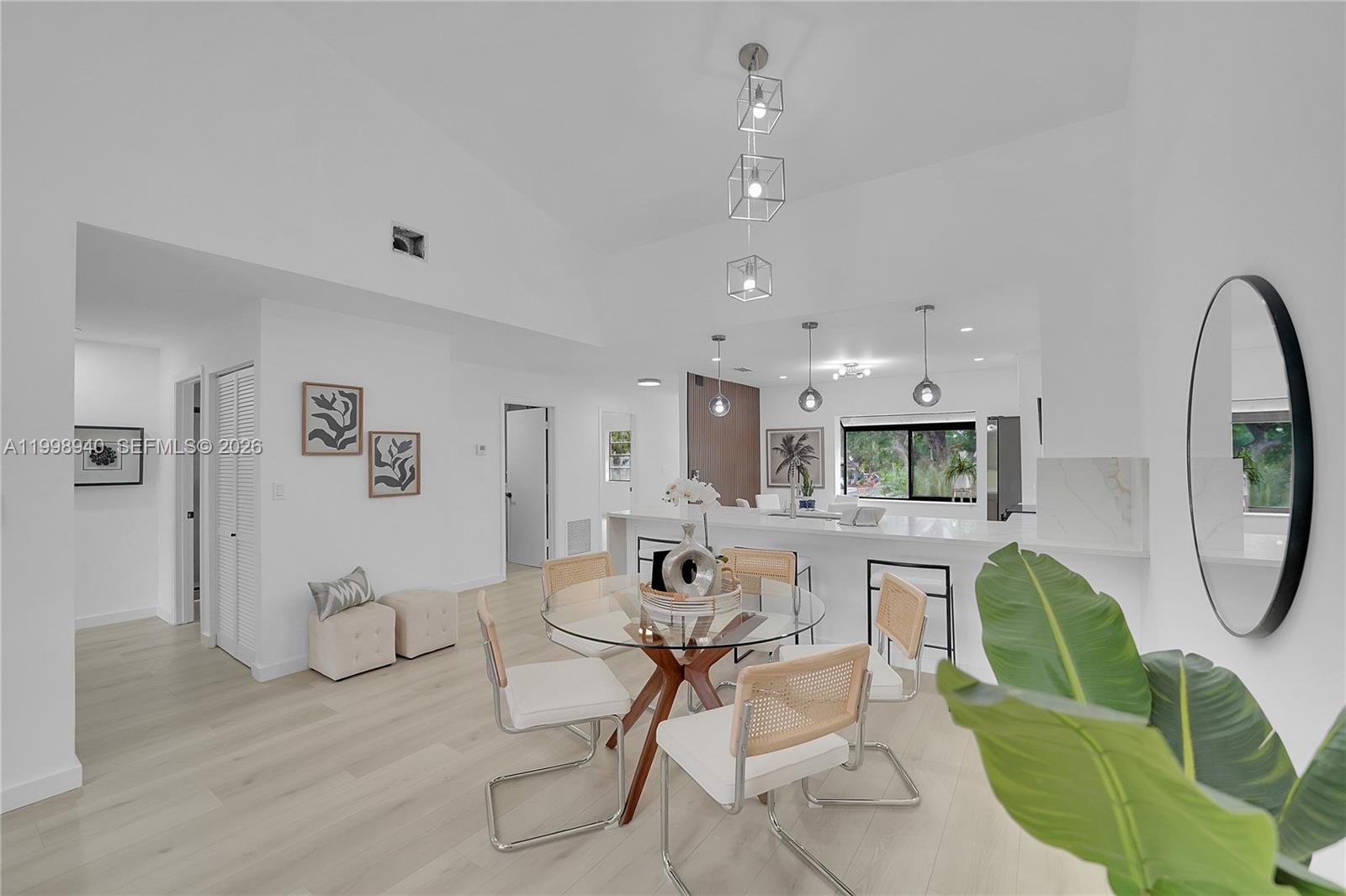 7736 La Mirada Drive Boca Raton, FL 33433 - Photo 9 of 56 a living room with furniture a flat screen tv and a table