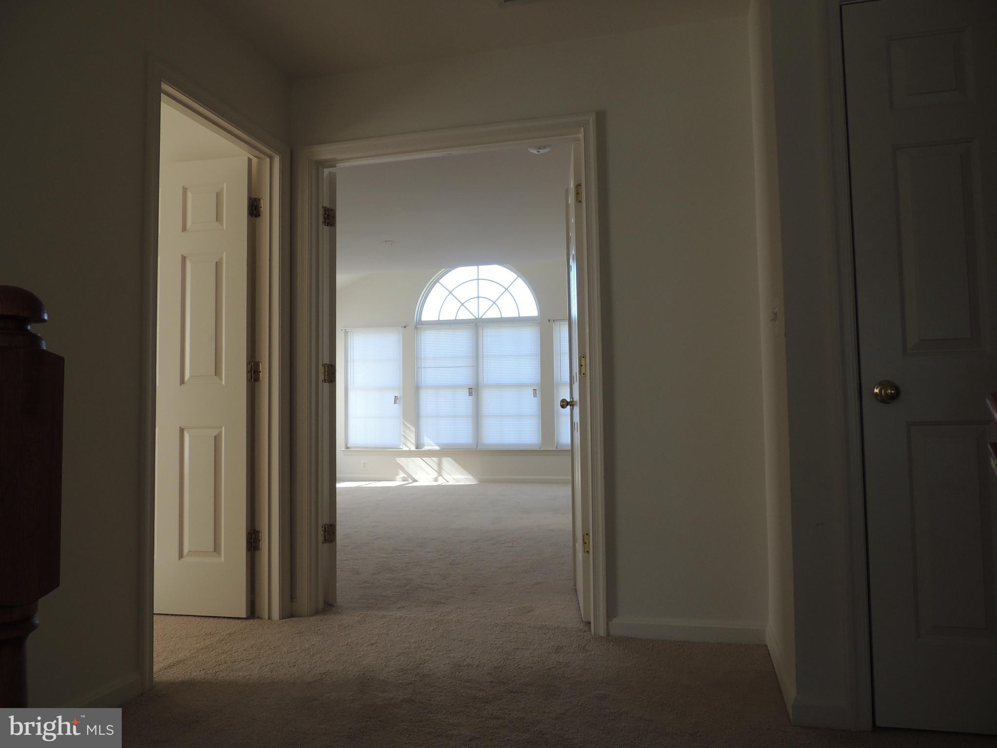 17676 Hampstead Ridge Court Dumfries, VA 22026 - Photo 12 of 22 a view of an empty room with a fireplace and a window