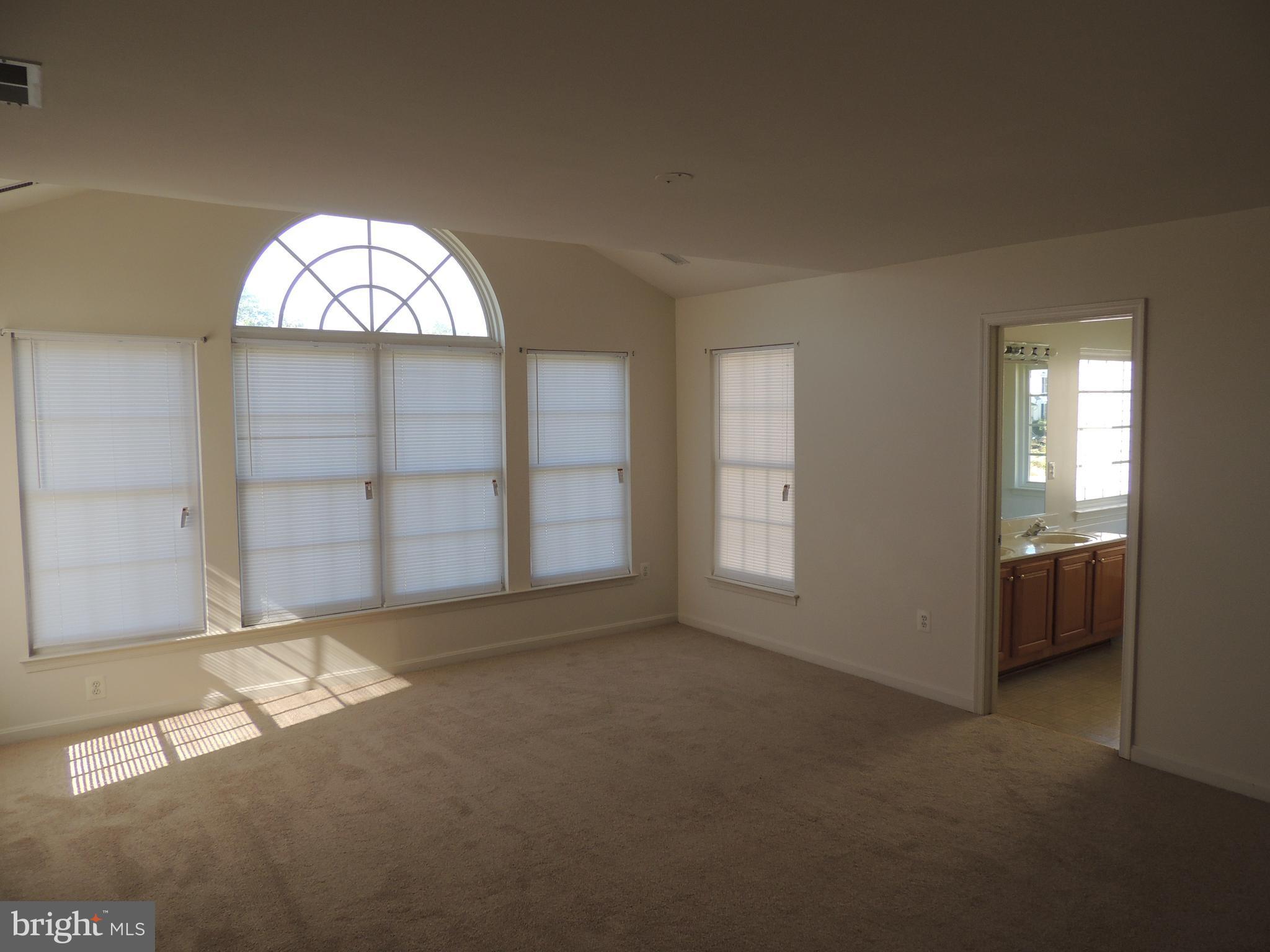17676 Hampstead Ridge Court Dumfries, VA 22026 - Photo 13 of 22 an empty room with windows