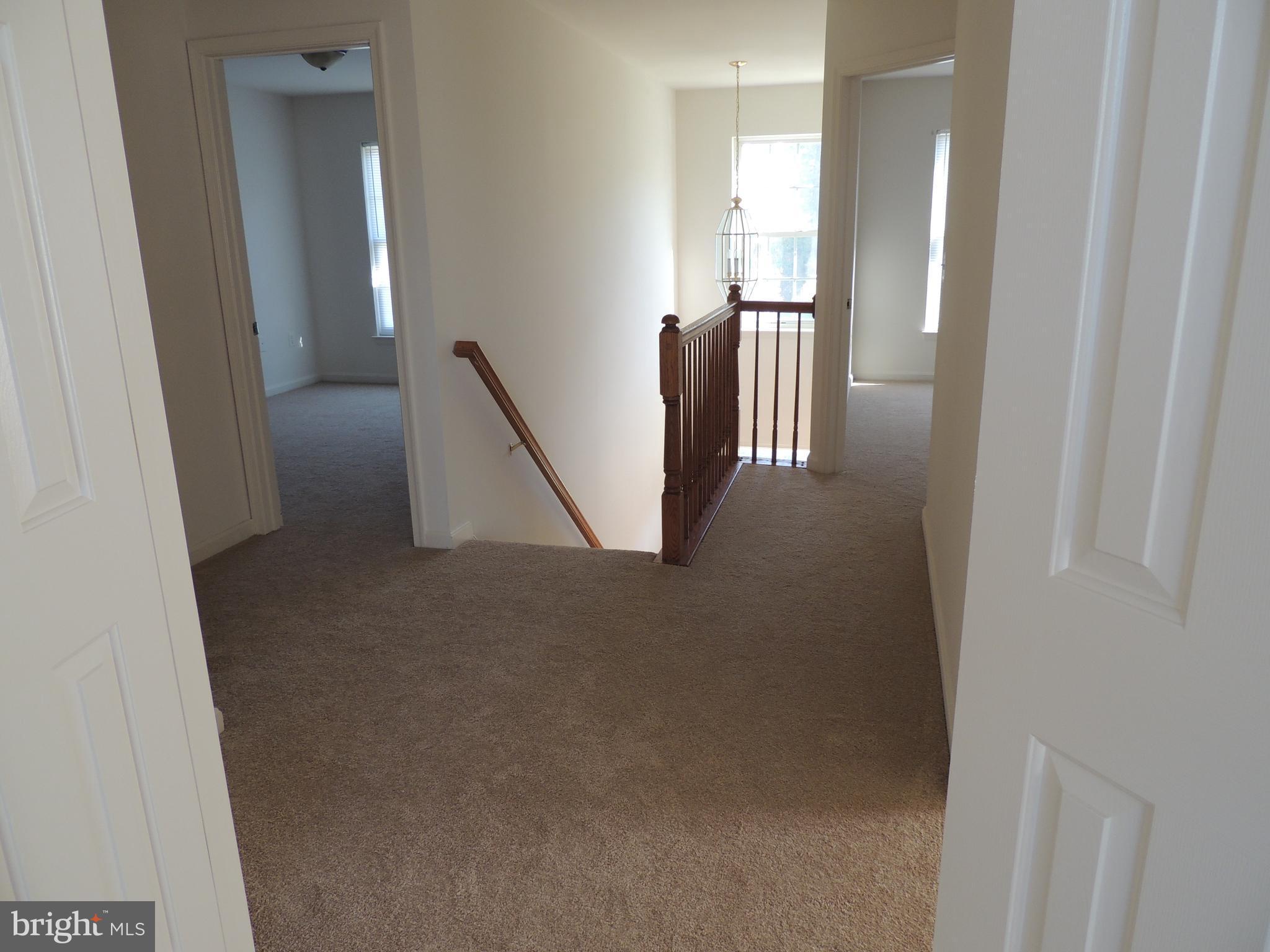 17676 Hampstead Ridge Court Dumfries, VA 22026 - Photo 16 of 22 a view of a hallway with windows
