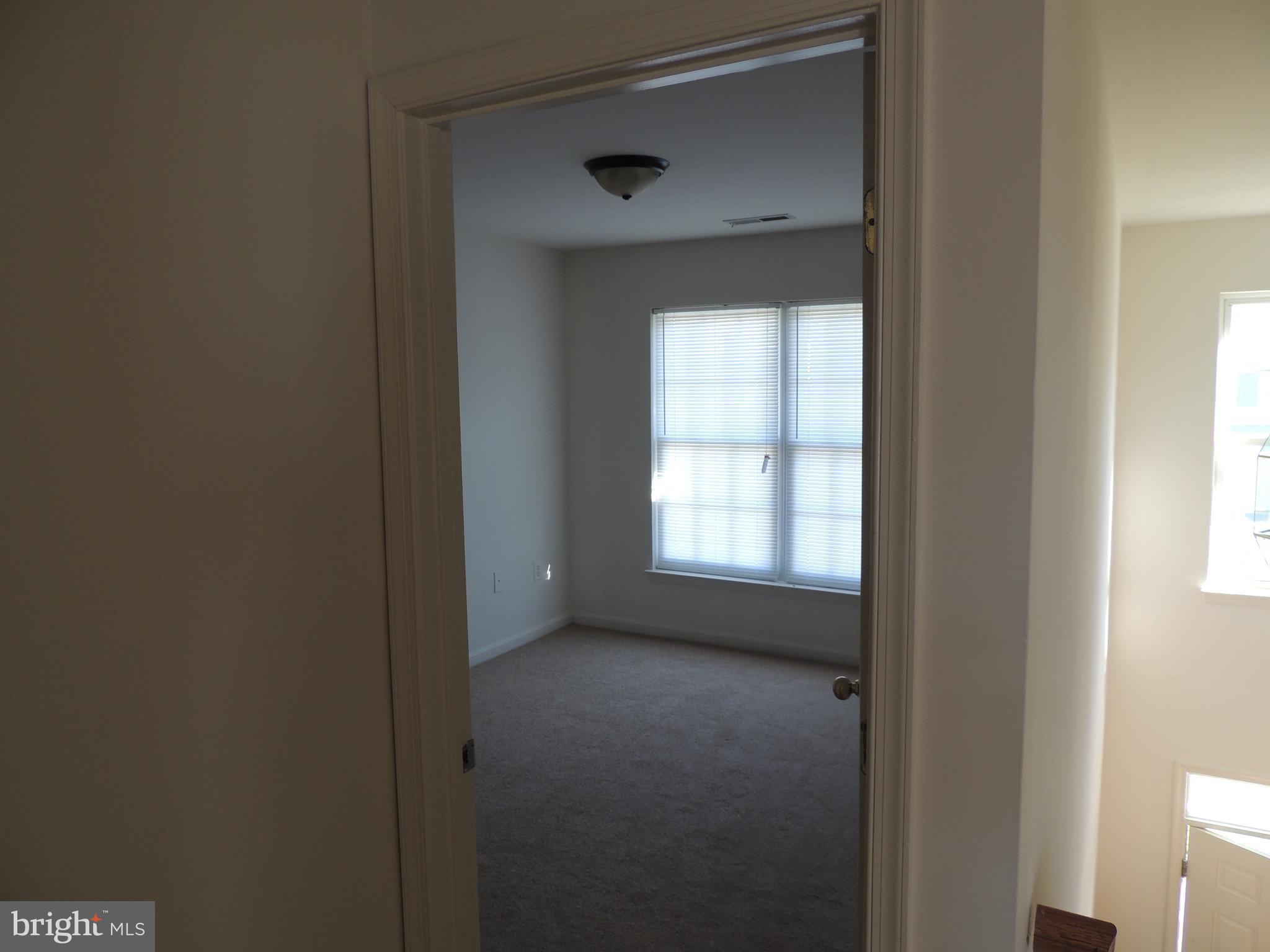 17676 Hampstead Ridge Court Dumfries, VA 22026 - Photo 17 of 22 a view of an empty room with a window