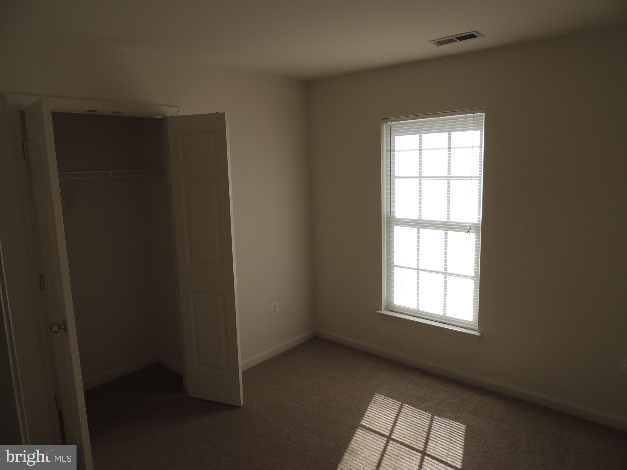 17676 Hampstead Ridge Court Dumfries, VA 22026 - Photo 18 of 22 an empty room with windows