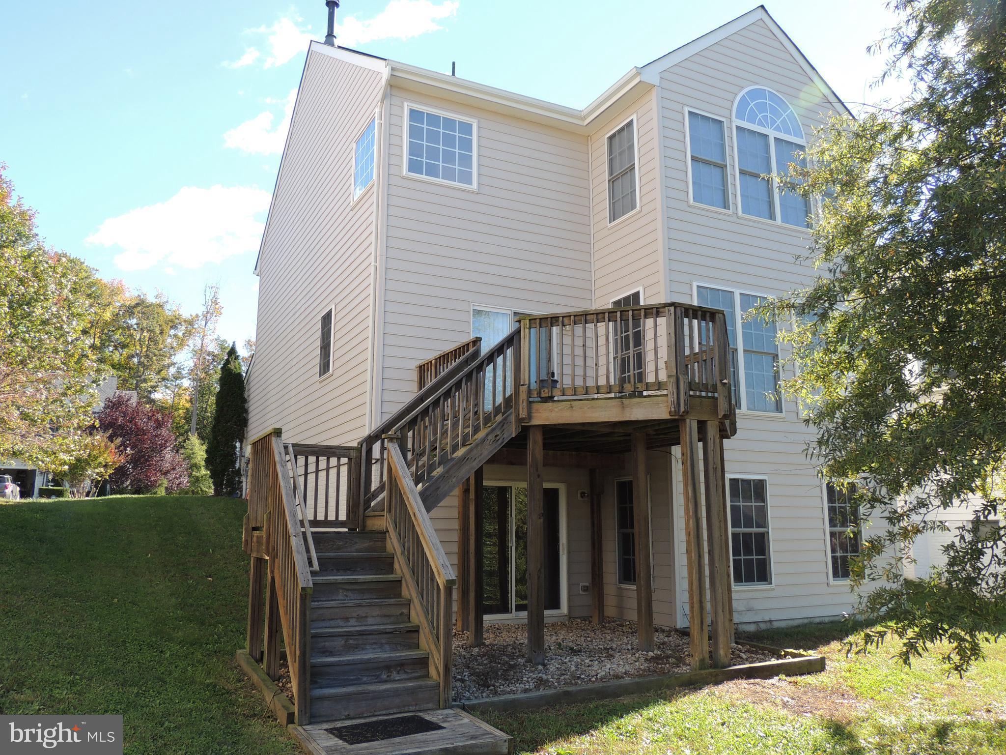 17676 Hampstead Ridge Court Dumfries, VA 22026 - Photo 22 of 22 front view of a house with a yard