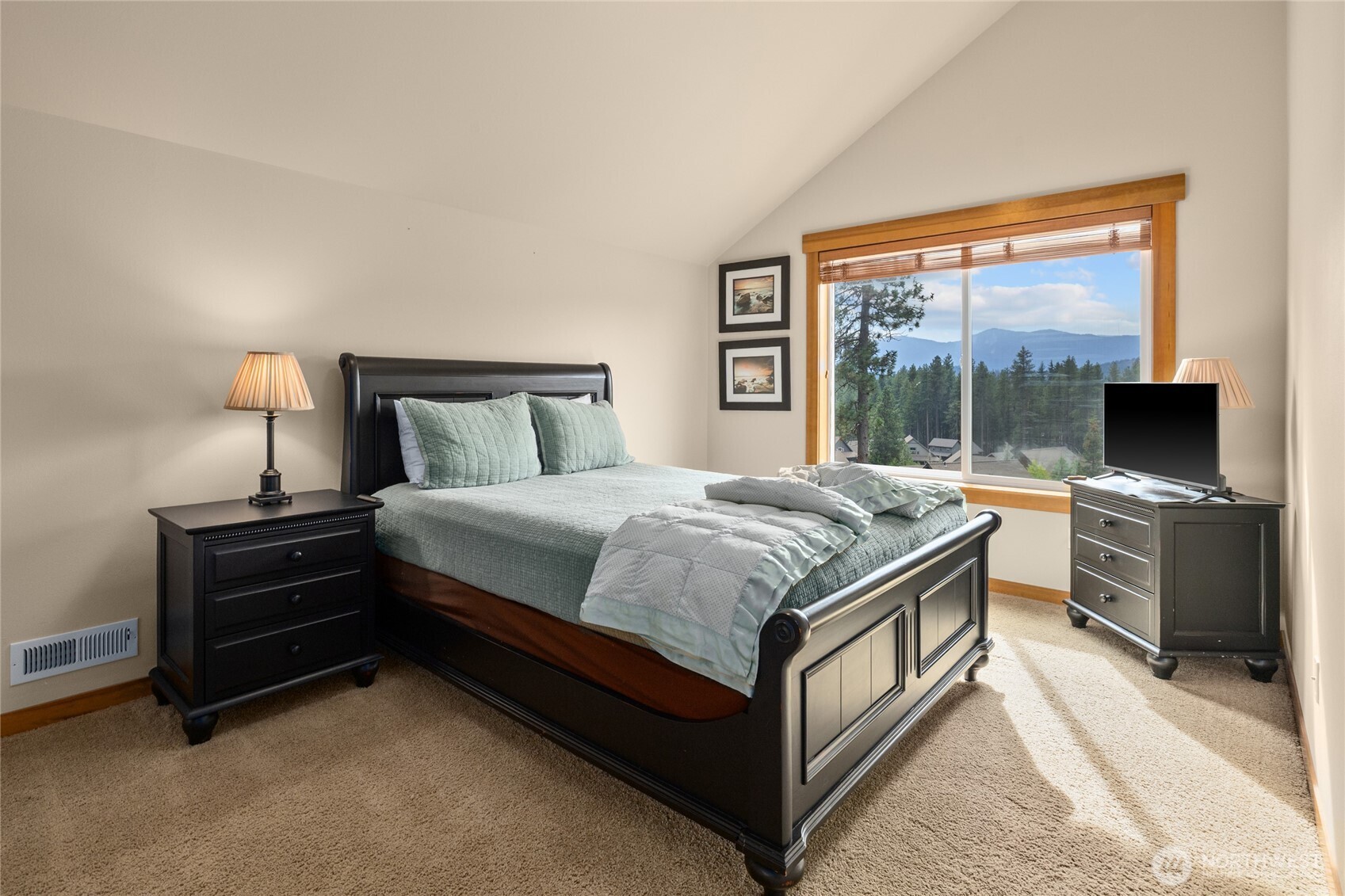 150 Tiger Lily Lane Ronald, WA 98940 - Photo 20 of 40 a bedroom with a bed and a flat screen tv