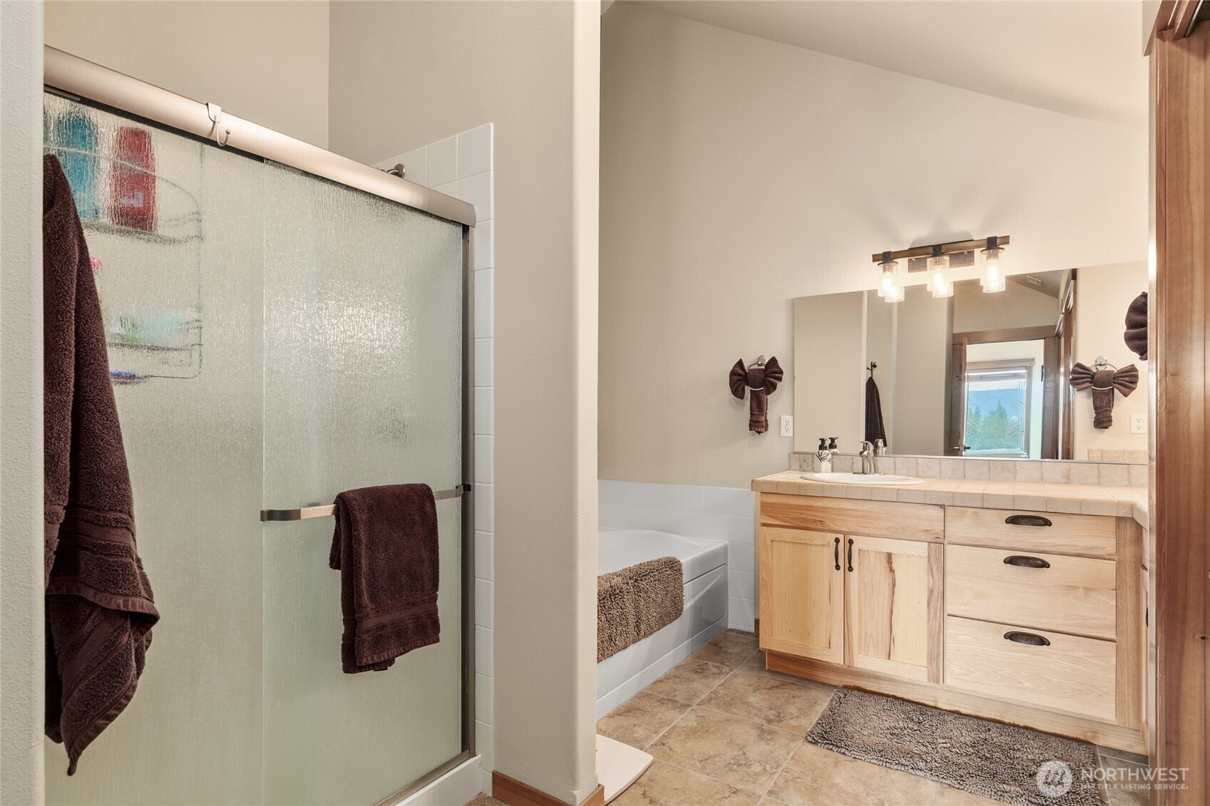 150 Tiger Lily Lane Ronald, WA 98940 - Photo 22 of 40 a bathroom with a sink mirror and vanity