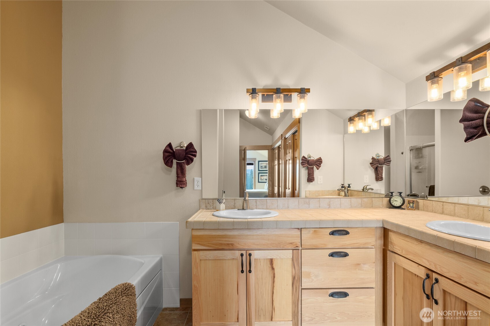 150 Tiger Lily Lane Ronald, WA 98940 - Photo 23 of 40 a bathroom with a granite countertop sink and a mirror