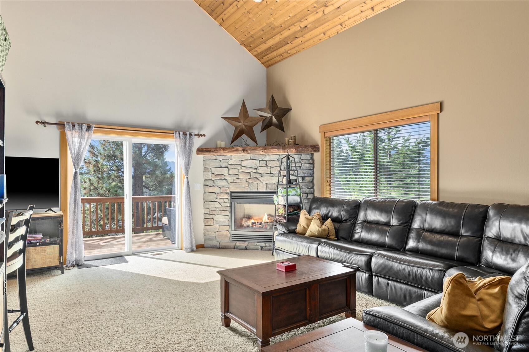 150 Tiger Lily Lane Ronald, WA 98940 - Photo 7 of 40 a living room with furniture a flat screen tv and a large window