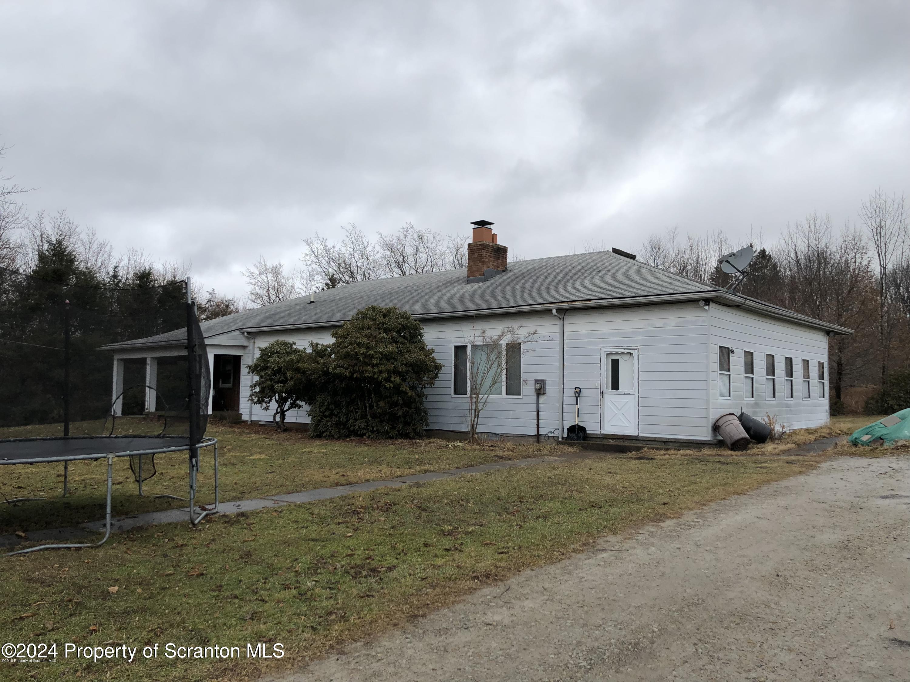 Red Oak Drive Clarks Summit, PA 18411 - Photo 4 of 7 a view of a house with a yard