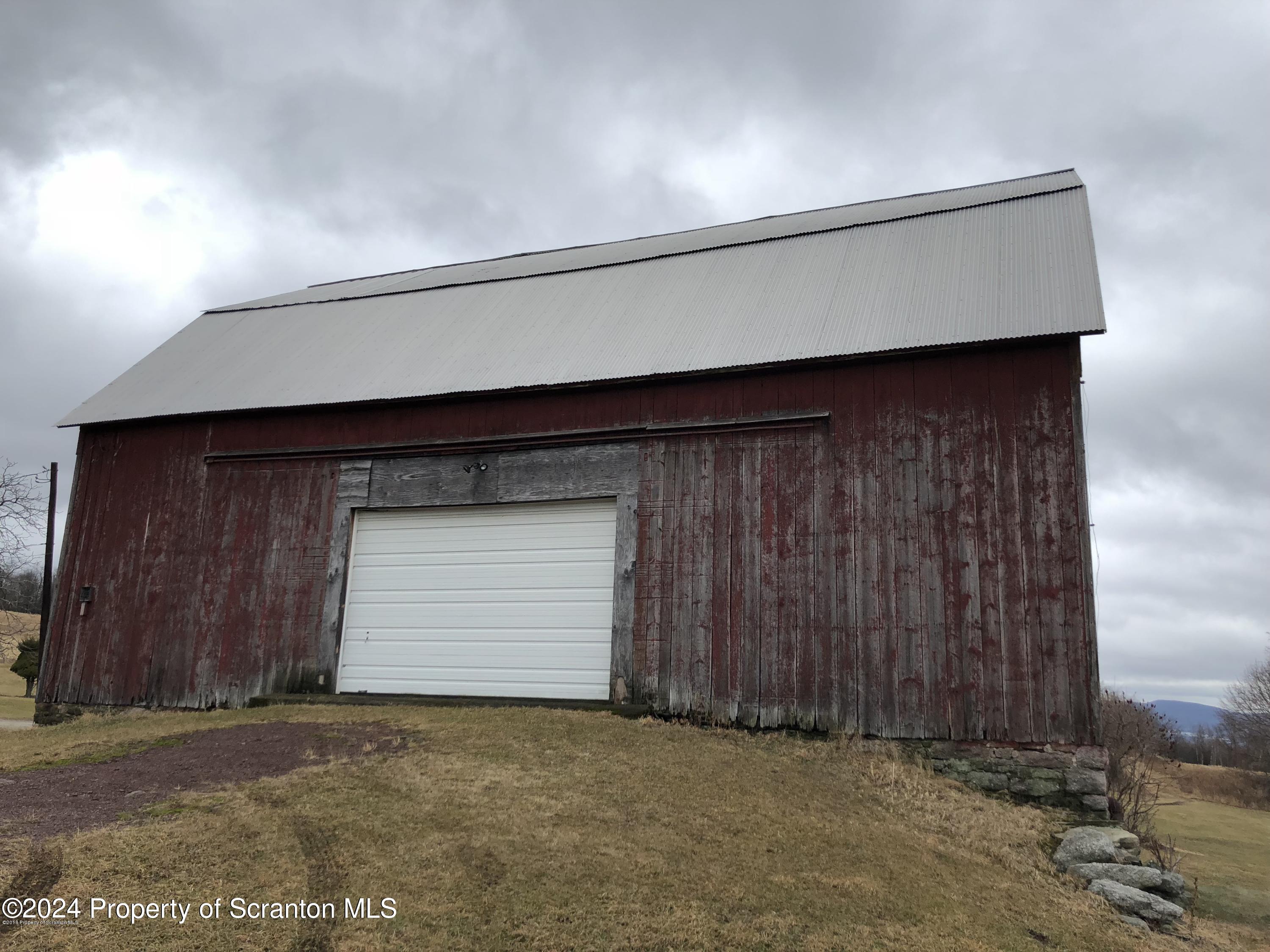 Red Oak Drive Clarks Summit, PA 18411 - Photo 7 of 7 a room with a wooden wall and a window