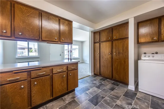 a view of a storage & utility room with a sink
