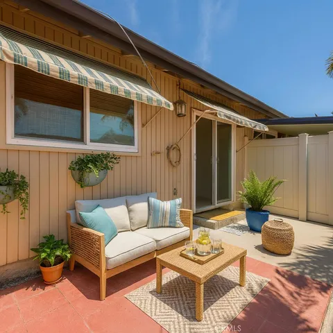a view of a house with yard porch and sitting area