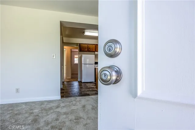 a view of a storage and utility room with a window