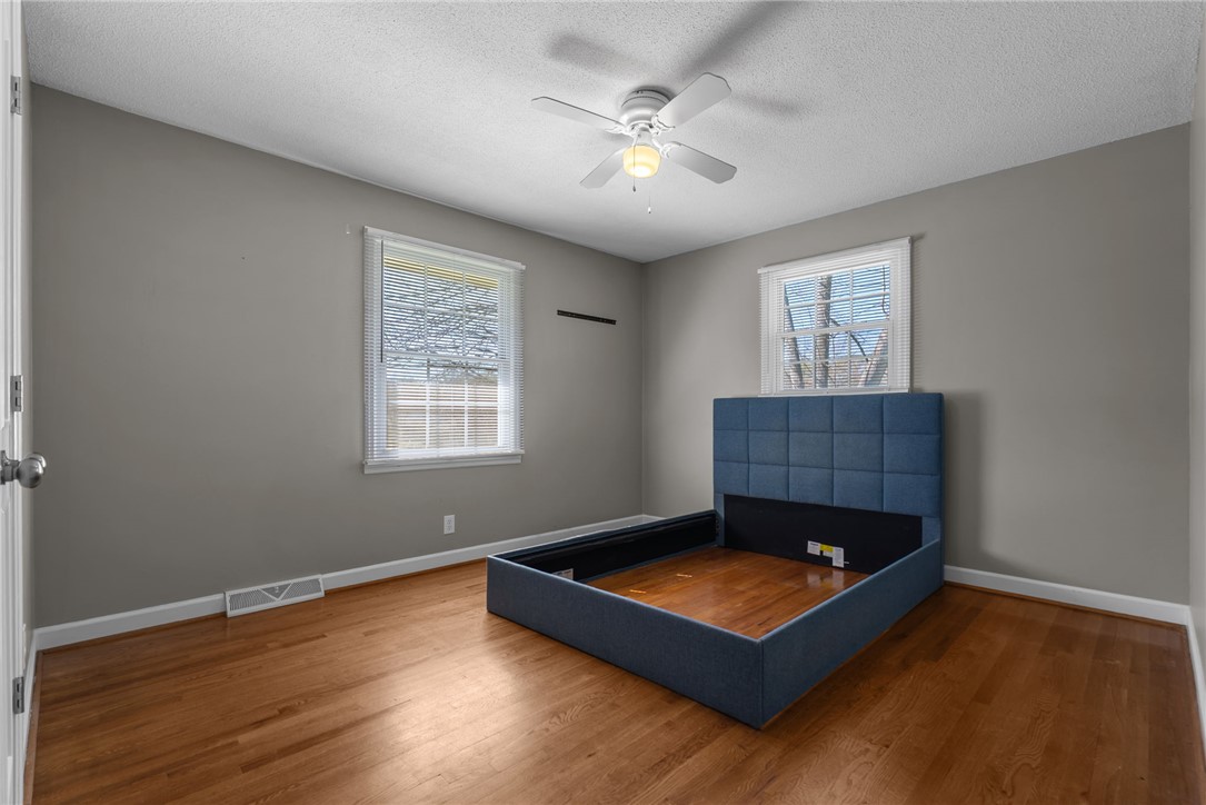 300 Green Street Williamston, SC 29697 - Photo 17 of 47 This inviting bedroom features rich hardwood flooring and abundant natural light.