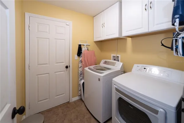 a view of storage and utility room with washer and dryer