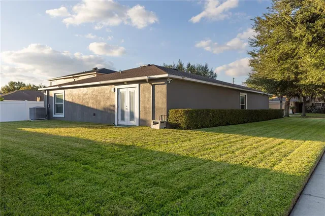 a backyard of a house with lots of green space