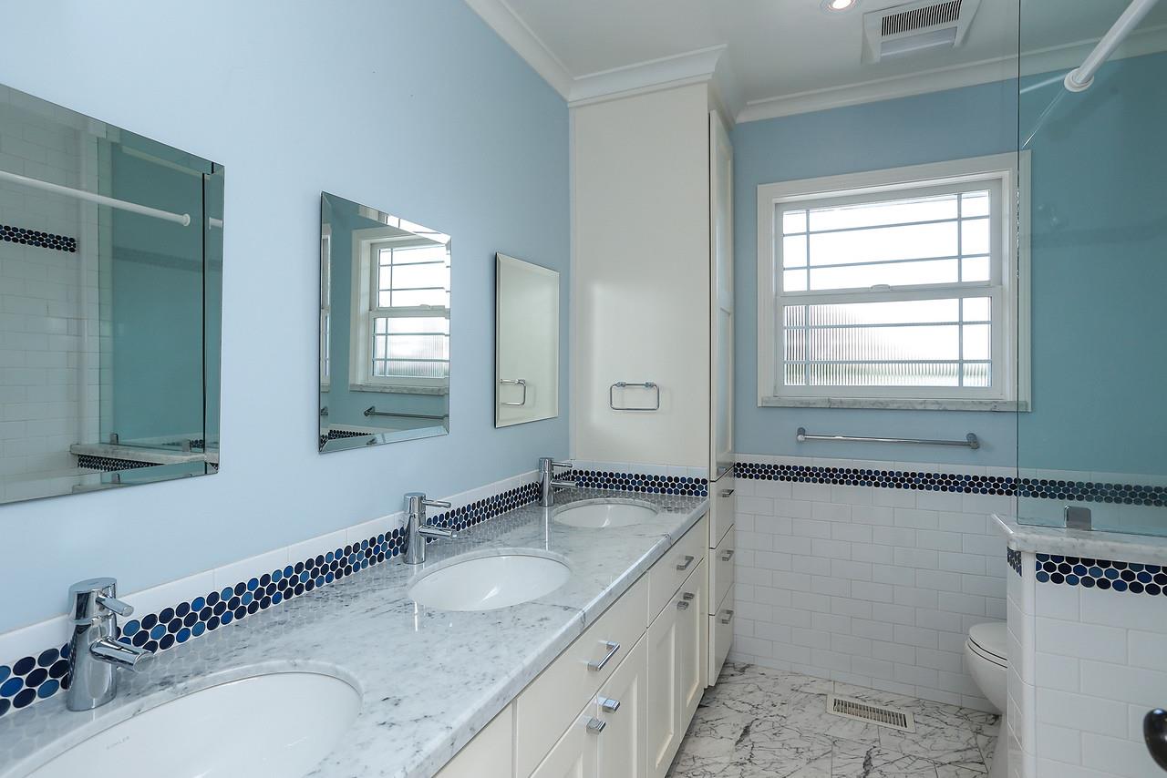 424 Sims Road Santa Cruz, CA 95060 - Photo 23 of 37 a bathroom with a granite countertop double vanity sink a mirror and a toilet