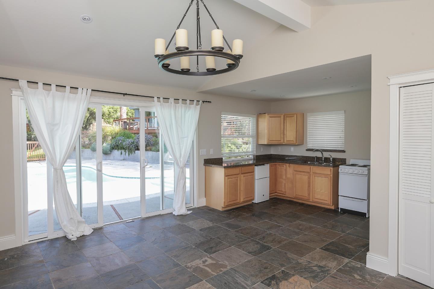 424 Sims Road Santa Cruz, CA 95060 - Photo 33 of 37 a large kitchen with a window and stainless steel appliances