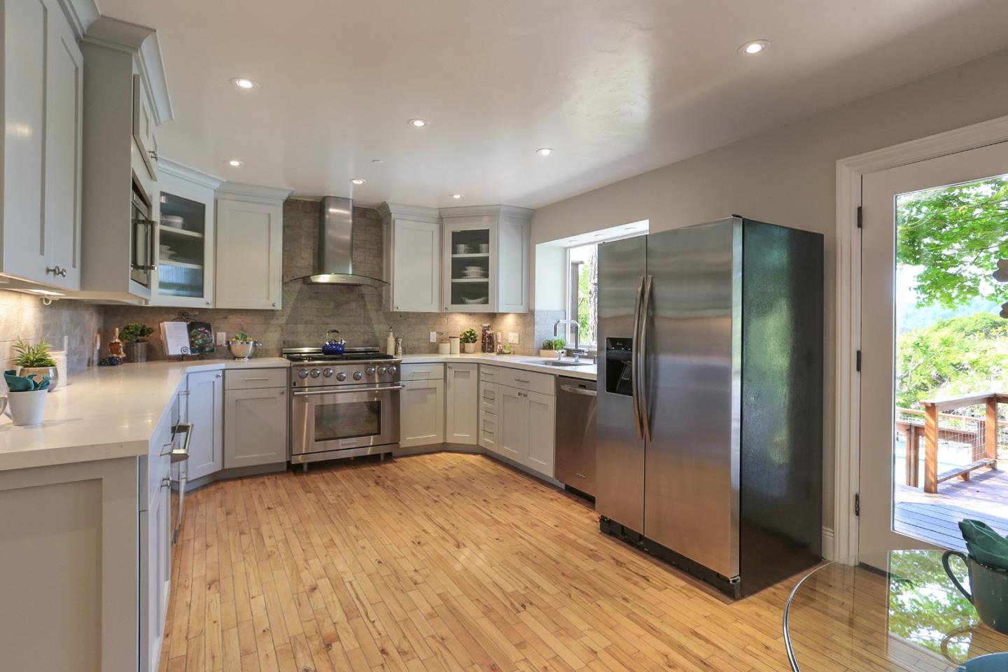 424 Sims Road Santa Cruz, CA 95060 - Photo 9 of 37 a kitchen with stainless steel appliances a refrigerator sink and cabinets