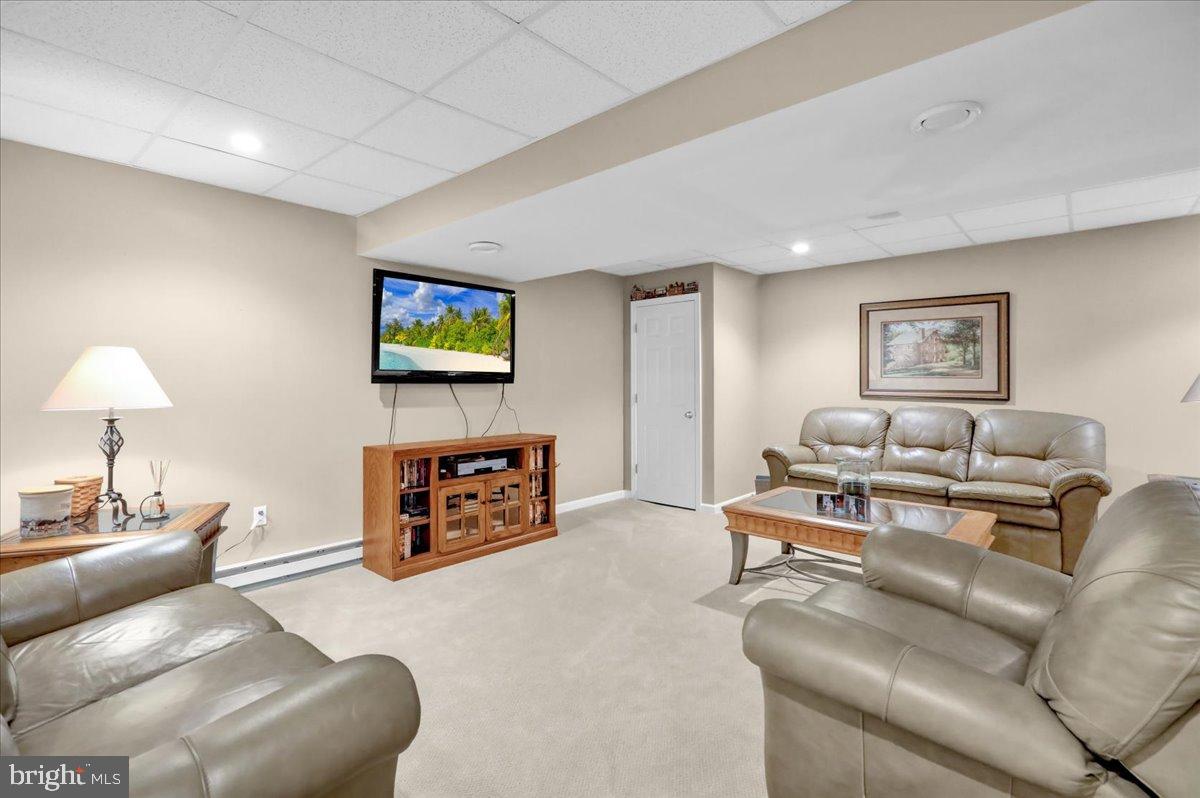 33 Michael Lane Denver, PA 17517 - Photo 20 of 24 Cozy basement retreat with modern amenities.