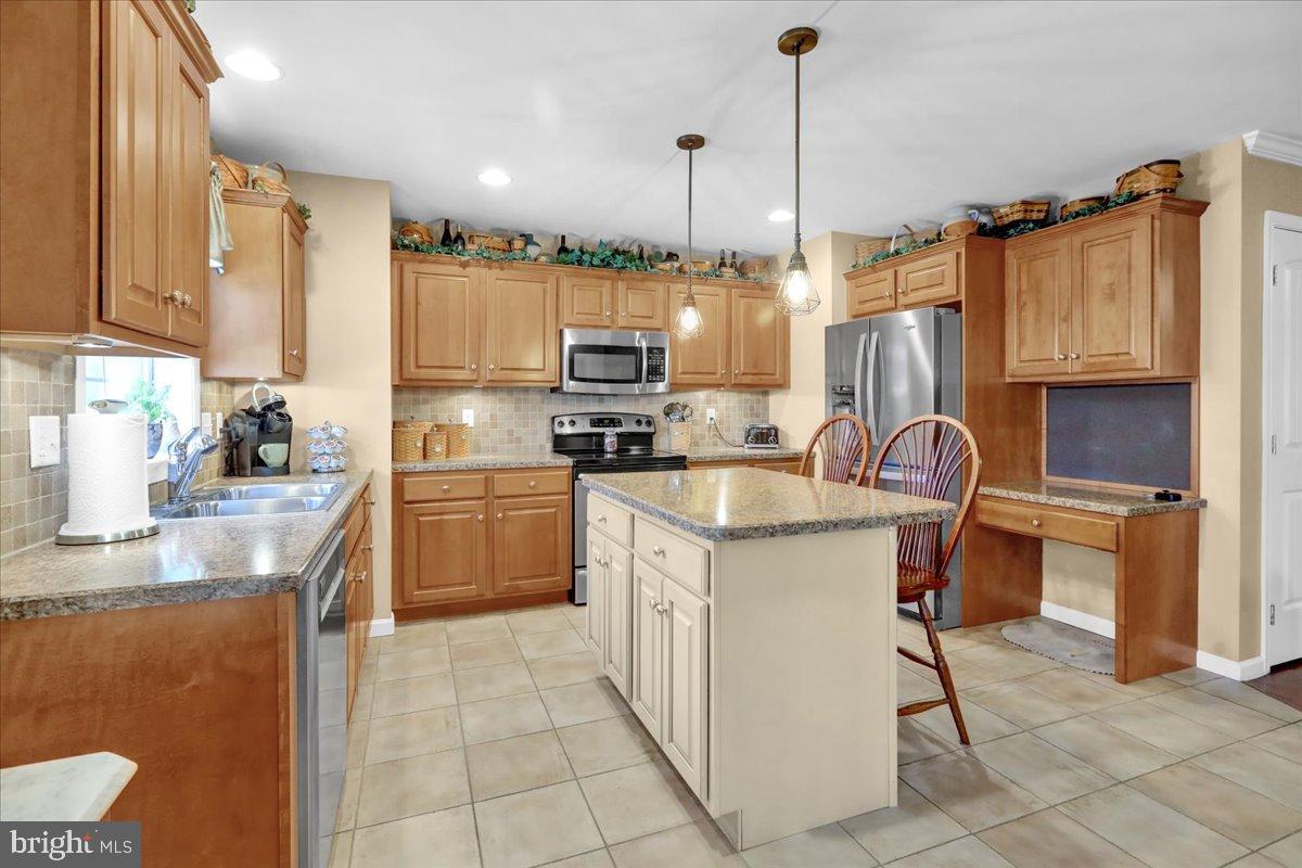 33 Michael Lane Denver, PA 17517 - Photo 4 of 24 Inviting kitchen with warm wood accents.