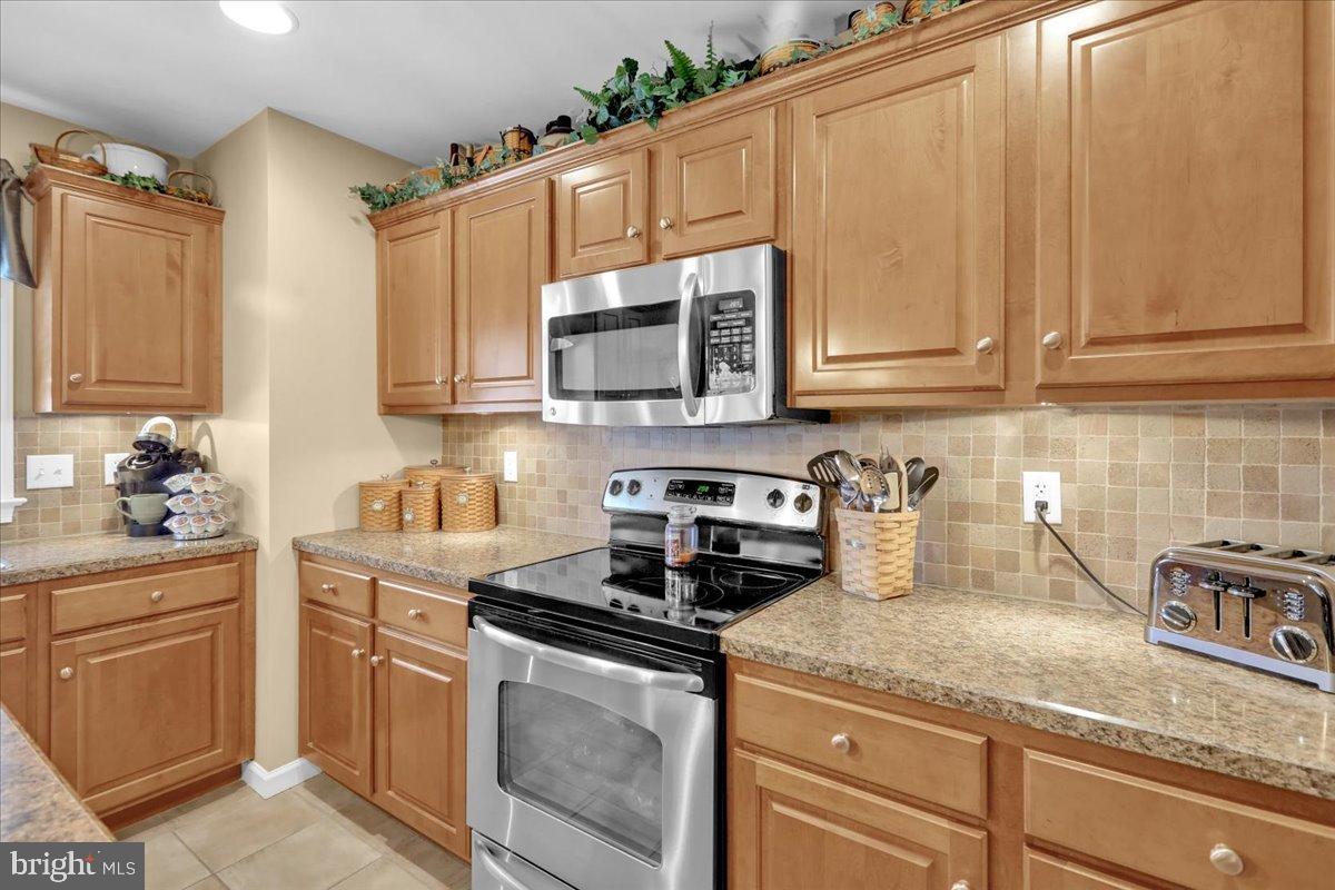 33 Michael Lane Denver, PA 17517 - Photo 6 of 24 Modern kitchen with warm wood cabinetry.
