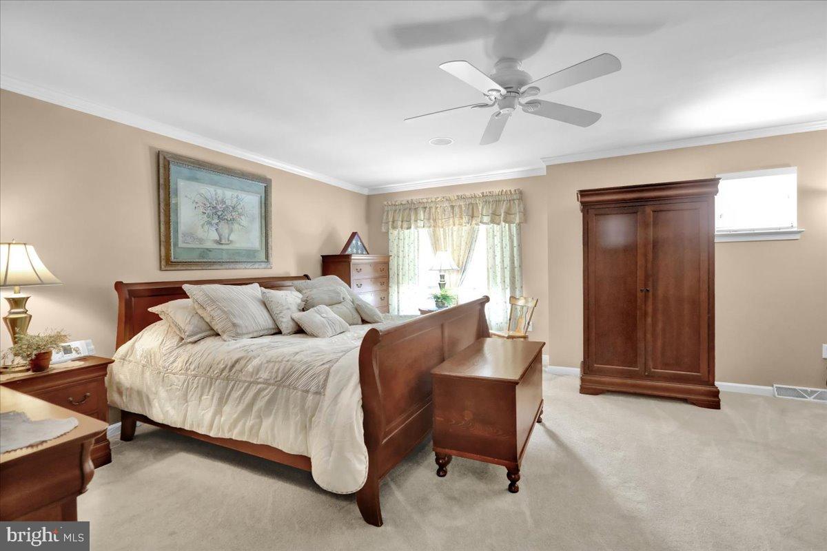 33 Michael Lane Denver, PA 17517 - Photo 10 of 24 Serene bedroom with elegant wooden accents.