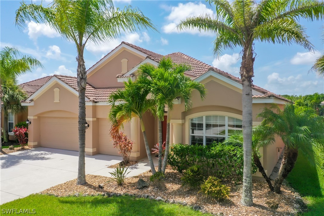 2816 Via Piazza Loop Fort Myers, FL 33905 - Photo 2 of 34 a front view of a house with garden