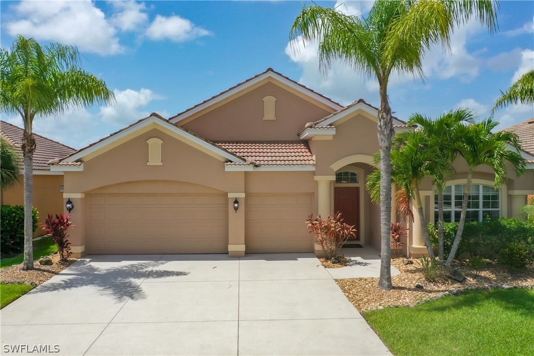 2816 Via Piazza Loop Fort Myers, FL 33905 - Photo 33 of 34 a front view of a house with garden
