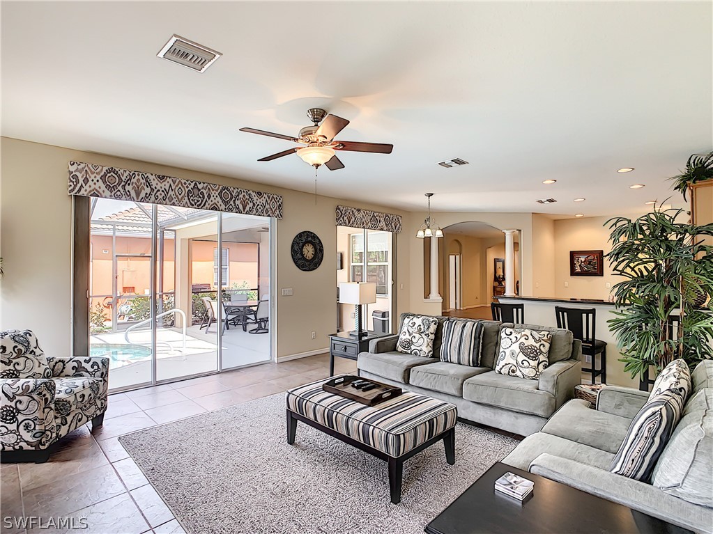 2816 Via Piazza Loop Fort Myers, FL 33905 - Photo 6 of 34 a living room with furniture and a large window