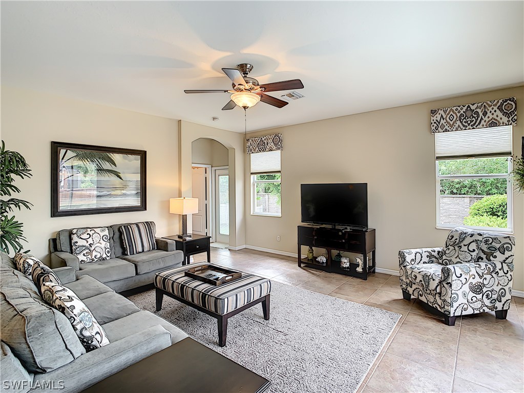 2816 Via Piazza Loop Fort Myers, FL 33905 - Photo 7 of 34 a living room with furniture and a flat screen tv