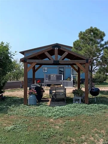 a view of a porch with dining area