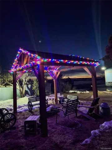 view of a terrace with lawn chairs