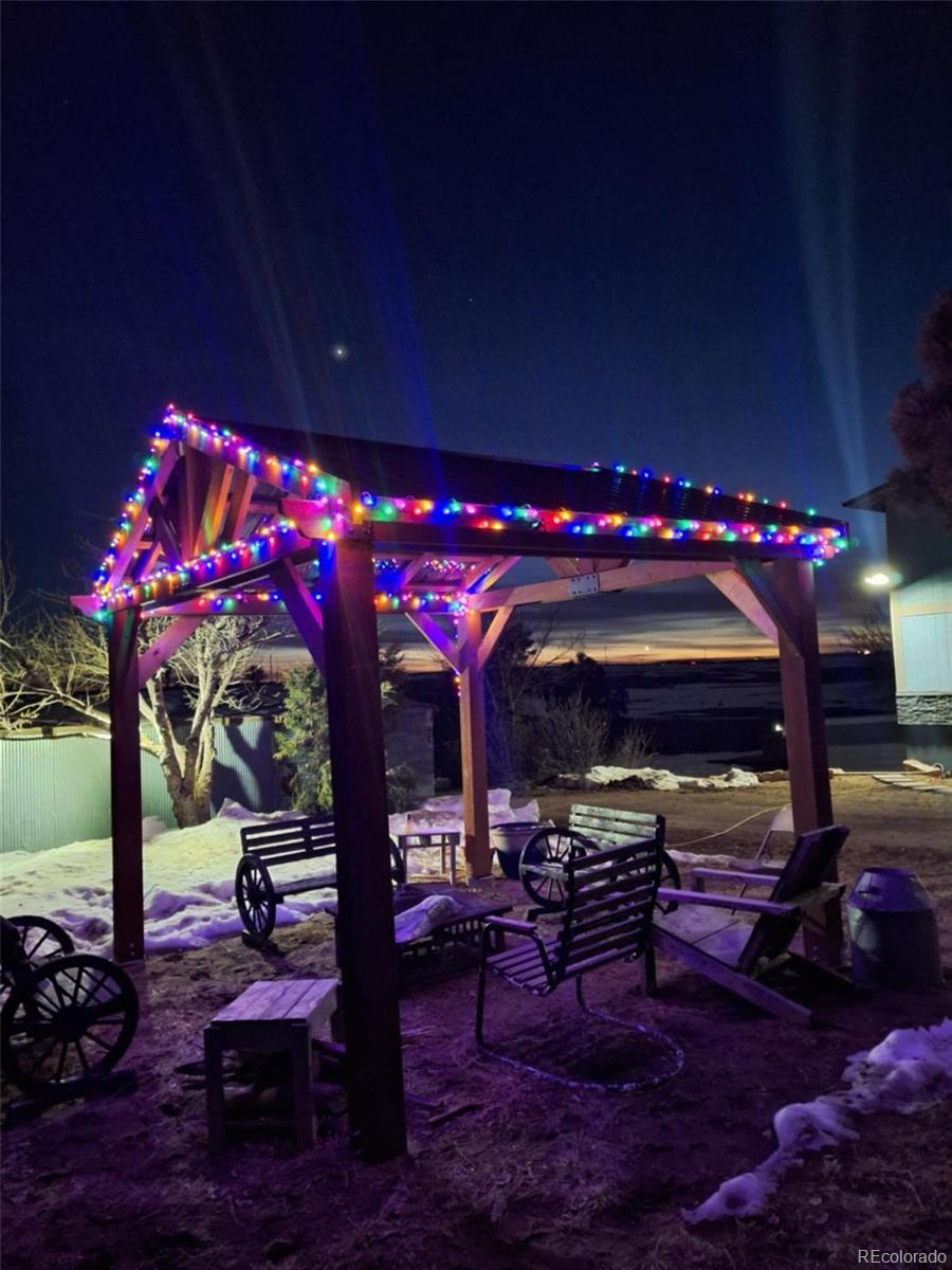 53647 County Road Genoa, CO 80818 - Photo 12 of 47 a view of a porch with dining area