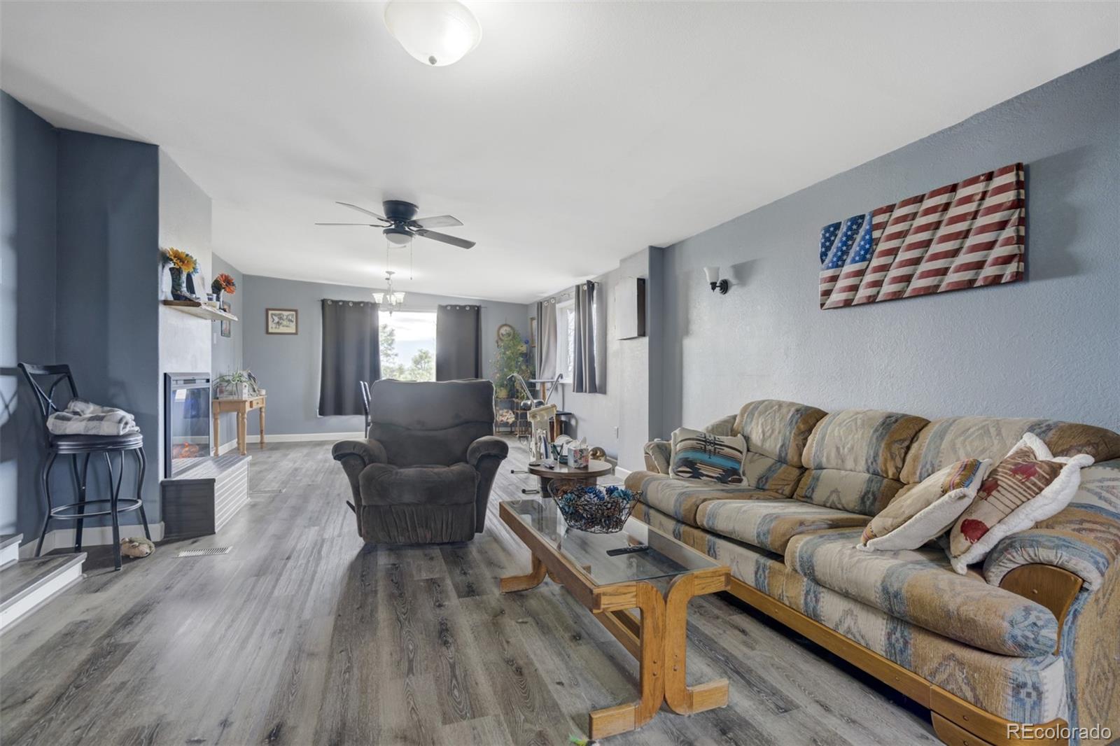 53647 County Road Genoa, CO 80818 - Photo 15 of 47 a living room with furniture and a wooden floor