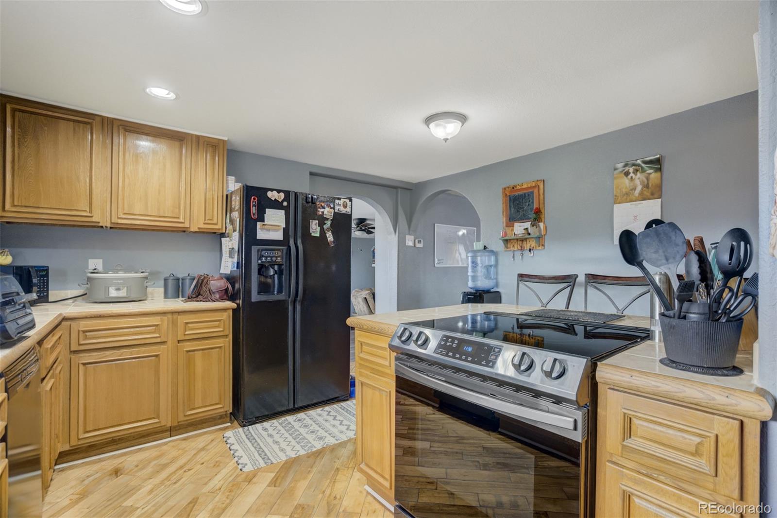 53647 County Road Genoa, CO 80818 - Photo 17 of 47 a kitchen with a stove and cabinets