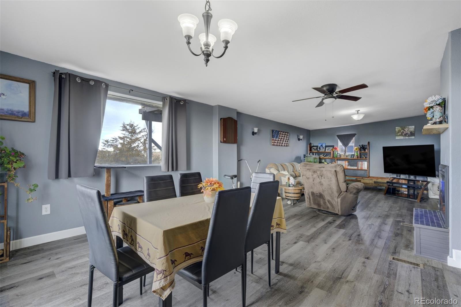 53647 County Road Genoa, CO 80818 - Photo 20 of 47 a view of a dining room with furniture a rug and wooden floor