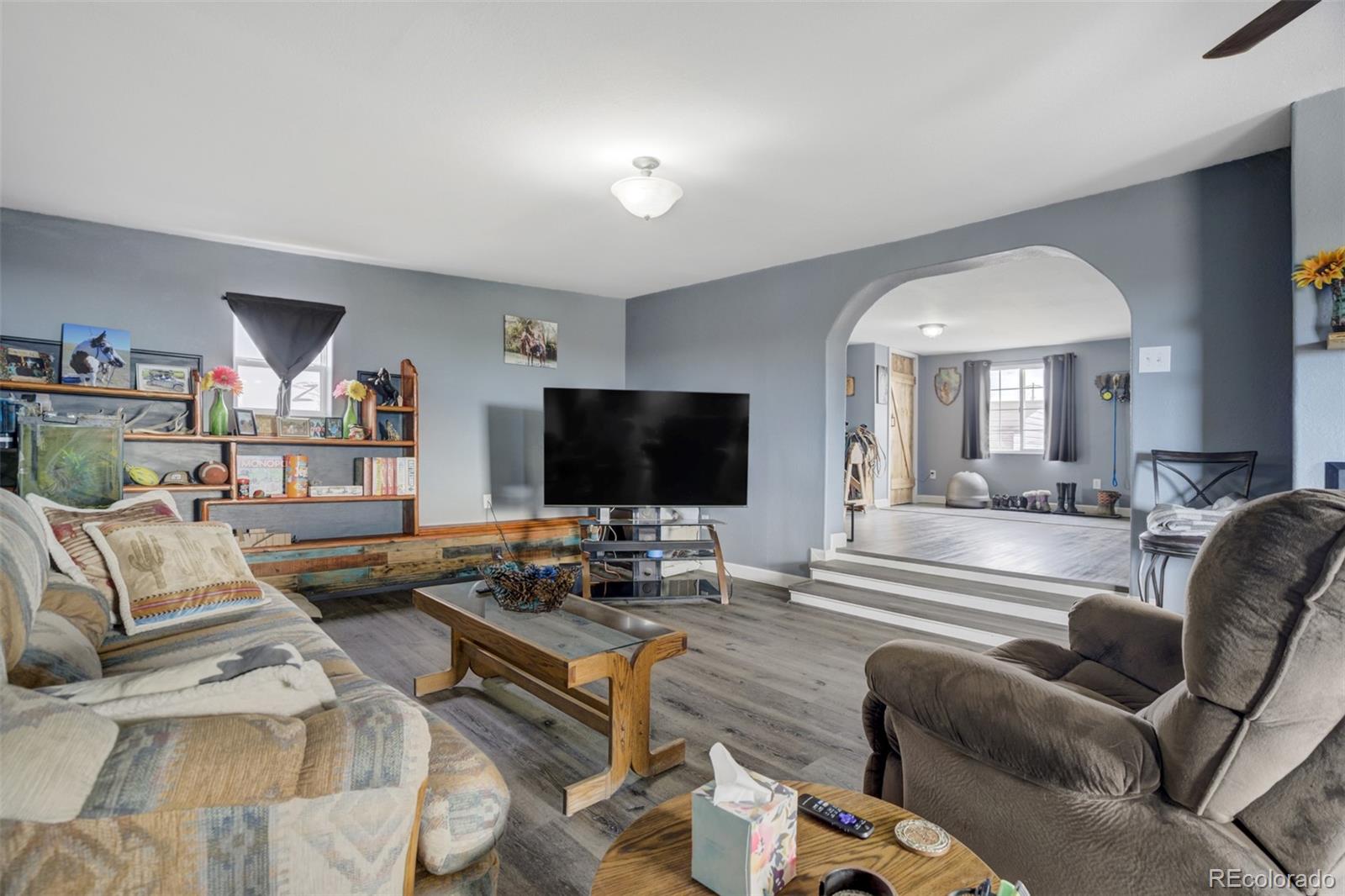 53647 County Road Genoa, CO 80818 - Photo 22 of 47 a living room with furniture and a flat screen tv