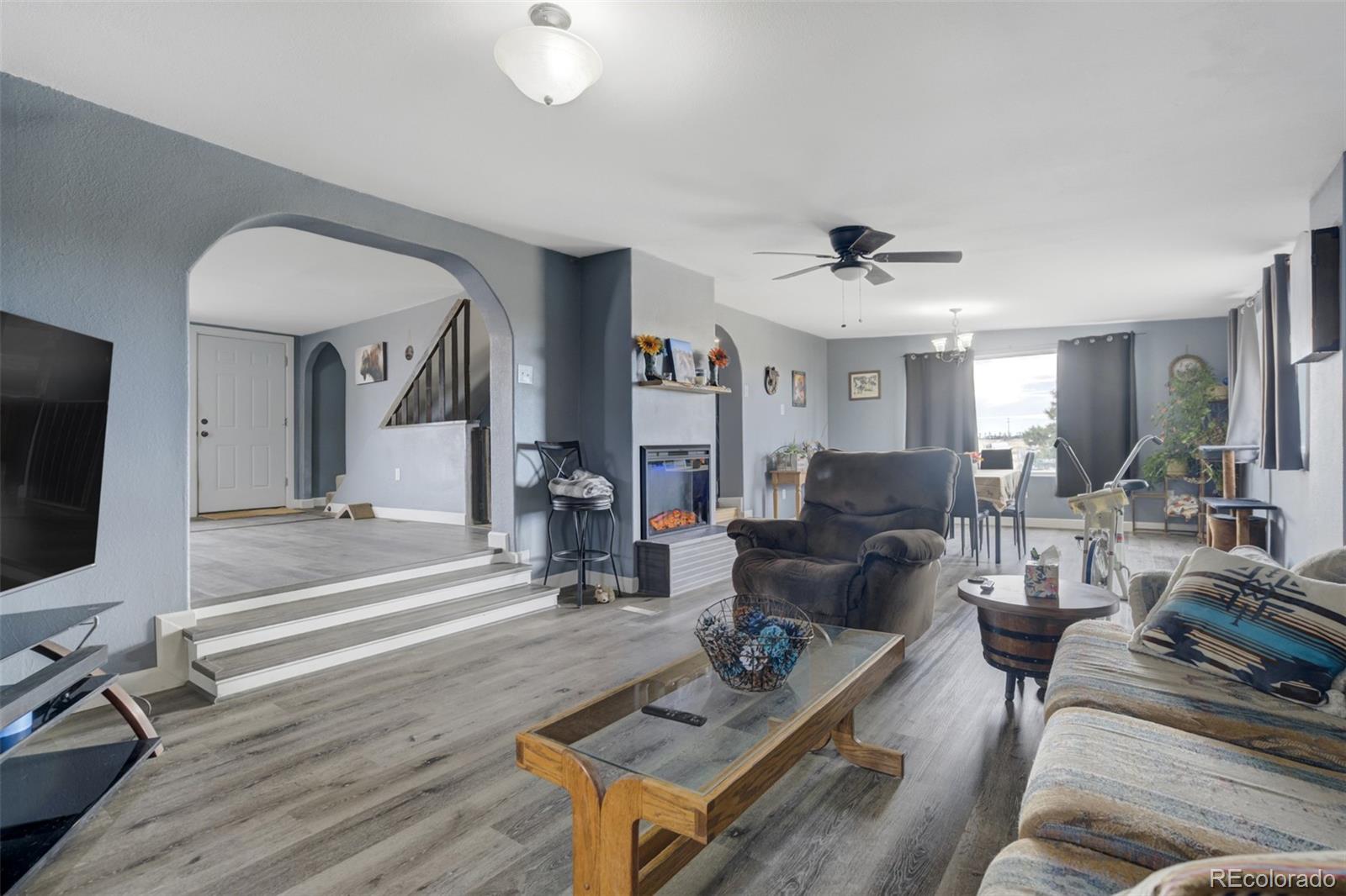 53647 County Road Genoa, CO 80818 - Photo 23 of 47 a living room with furniture and a flat screen tv
