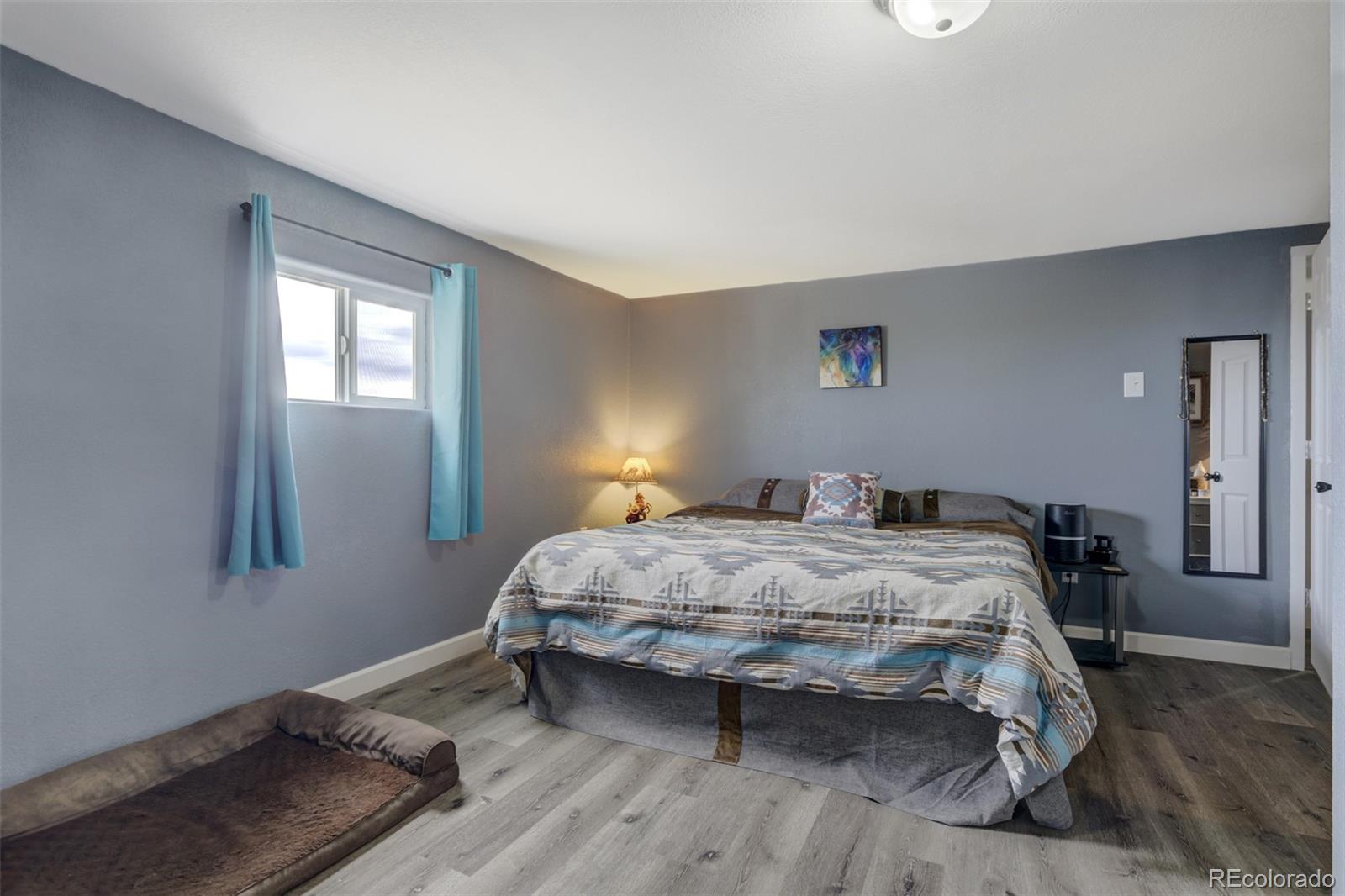 53647 County Road Genoa, CO 80818 - Photo 24 of 47 a bedroom with a bed and a window