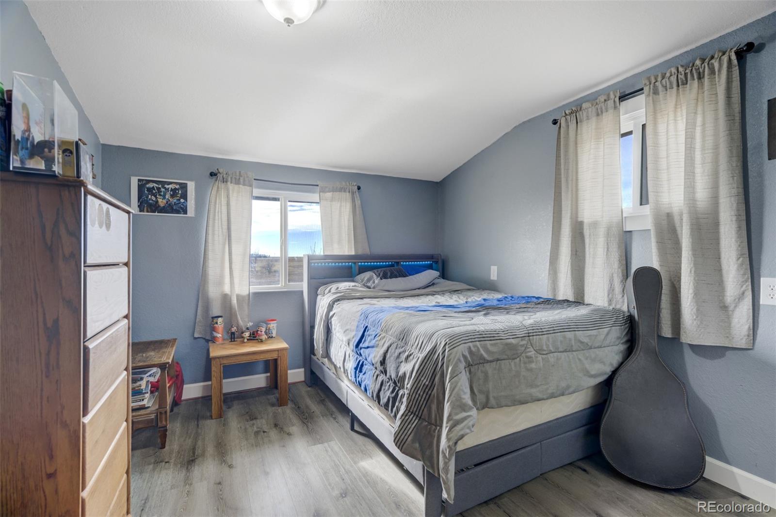 53647 County Road Genoa, CO 80818 - Photo 25 of 47 a bedroom with a bed and a window