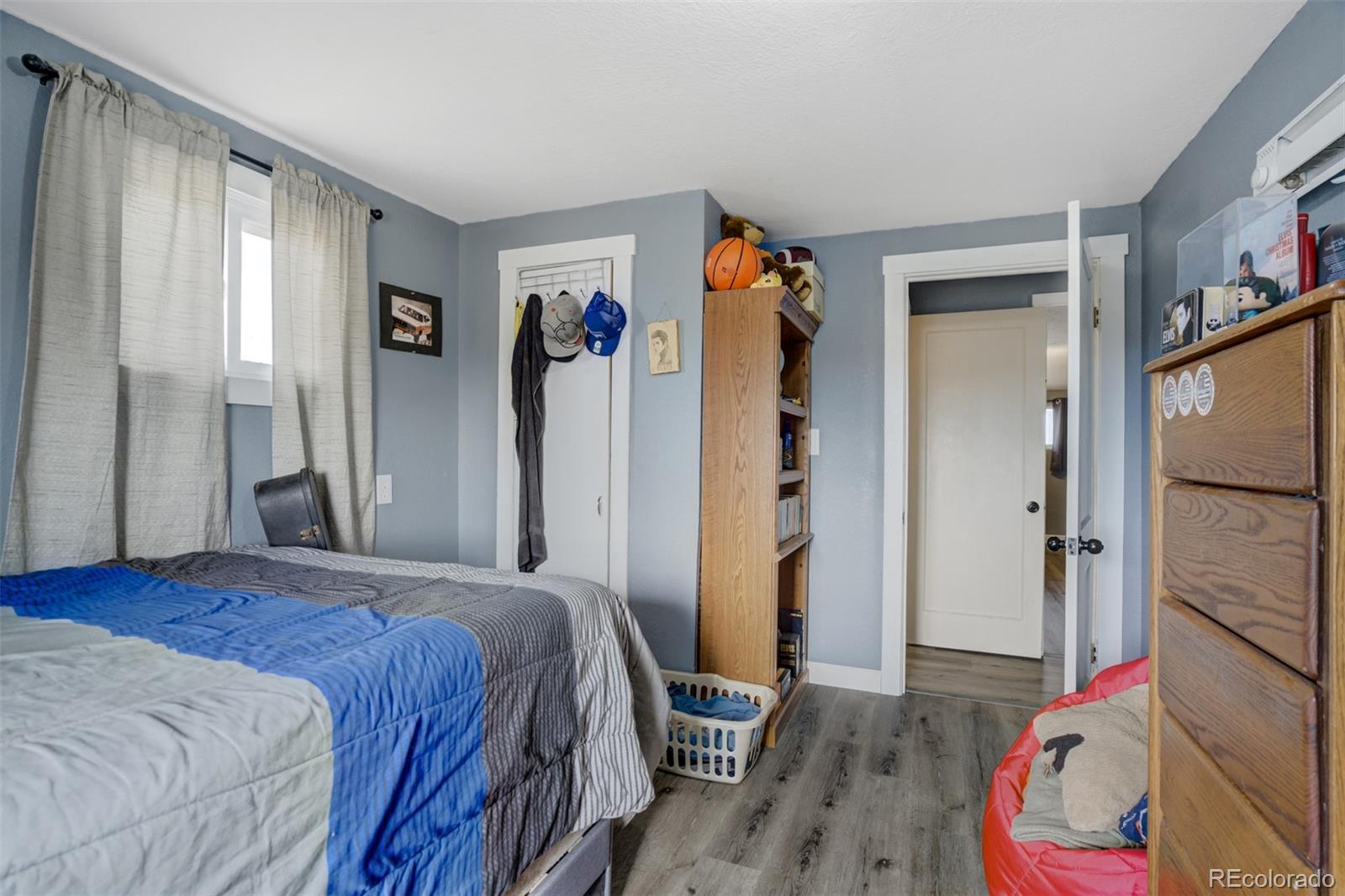 53647 County Road Genoa, CO 80818 - Photo 26 of 47 a bedroom with a bed and a couch