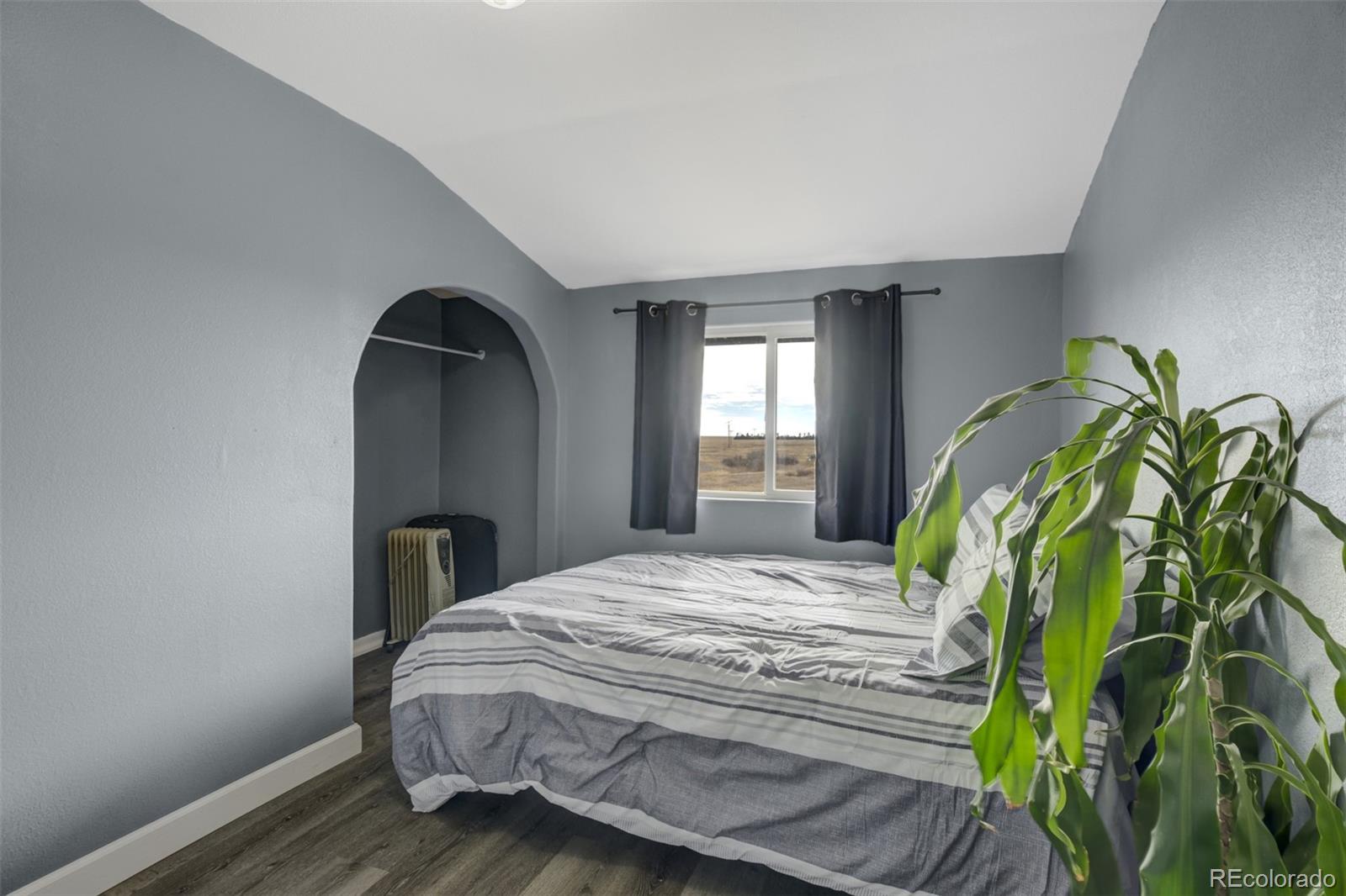 53647 County Road Genoa, CO 80818 - Photo 30 of 47 a bedroom with a bed and a window