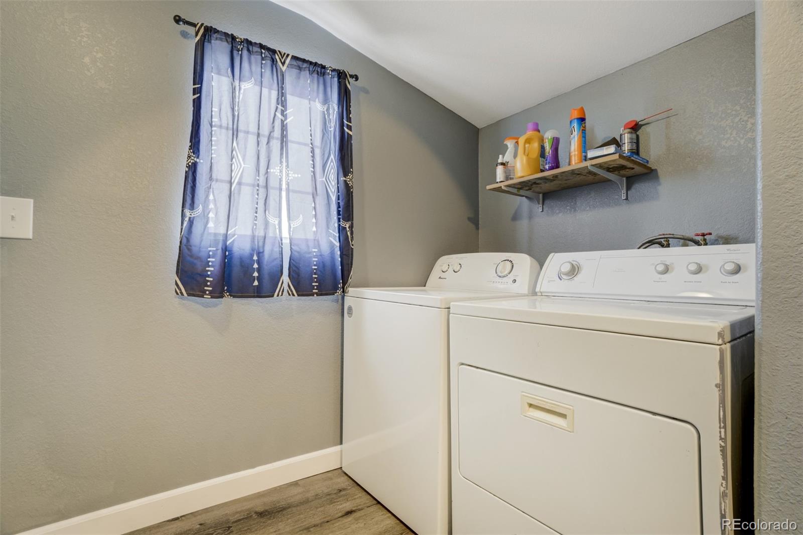 53647 County Road Genoa, CO 80818 - Photo 31 of 47 a utility room with dryer and washer