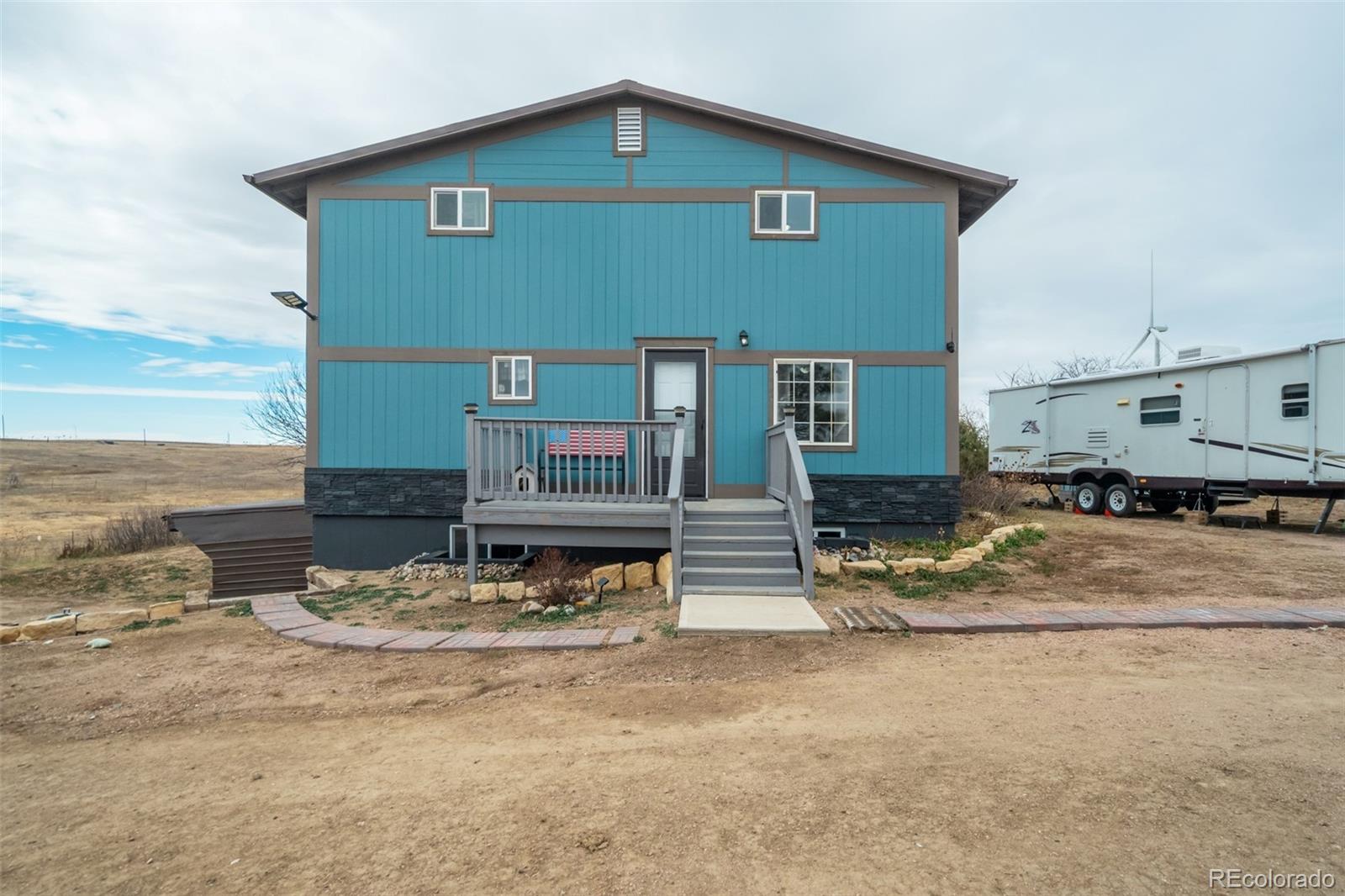 53647 County Road Genoa, CO 80818 - Photo 39 of 47 a view of a house with wooden fence