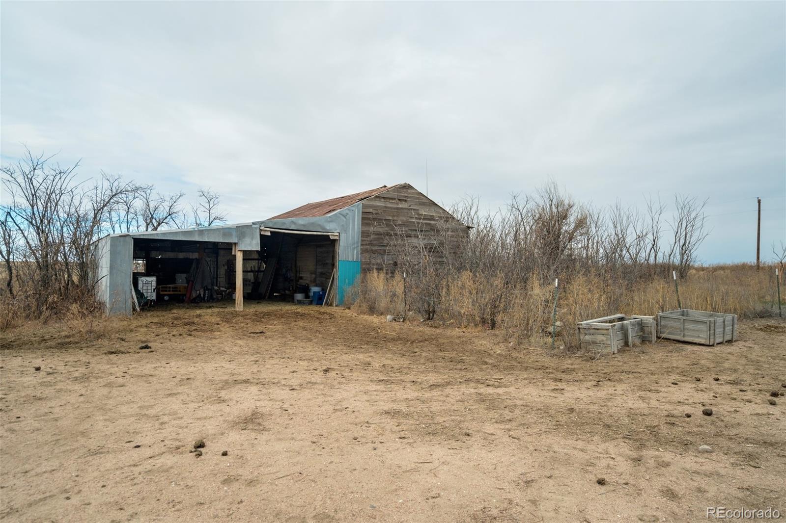 53647 County Road Genoa, CO 80818 - Photo 42 of 47 a front view of a house with a yard
