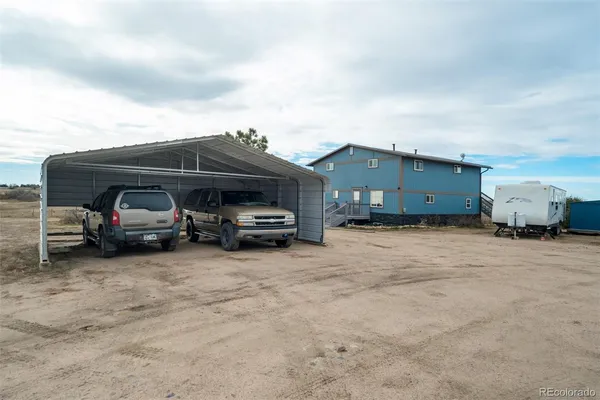 a view of a terrace with furniture