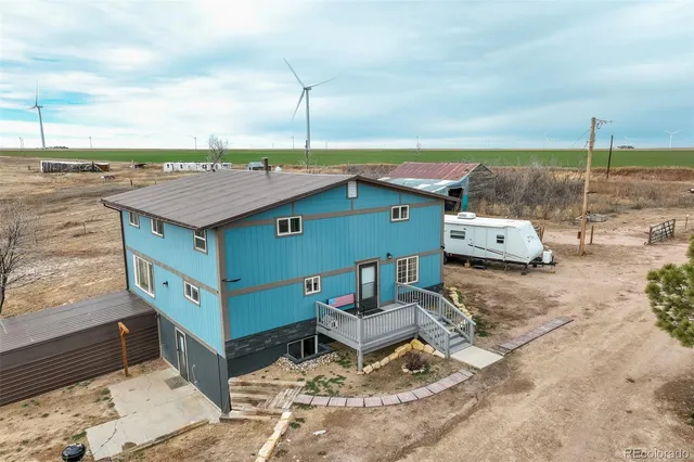 a patio with a patio table and chairs