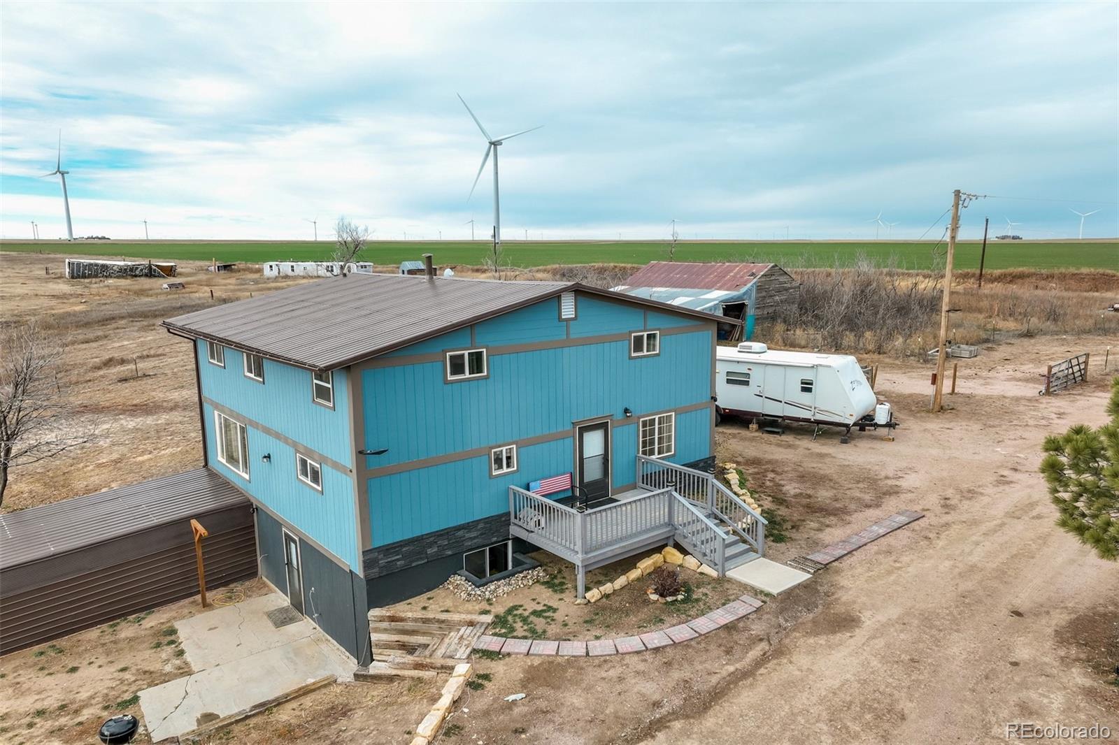 53647 County Road Genoa, CO 80818 - Photo 9 of 47 a view of a terrace with furniture