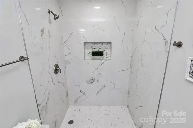 a bathroom with a bathtub and a shower