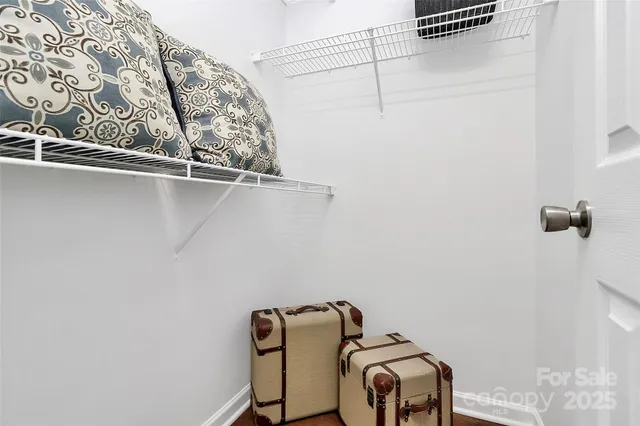 a view of a small space with racks on the wall